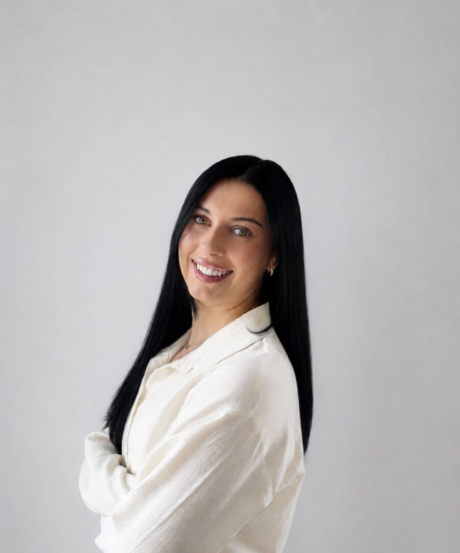 Portrait of woman in white top, dark hair